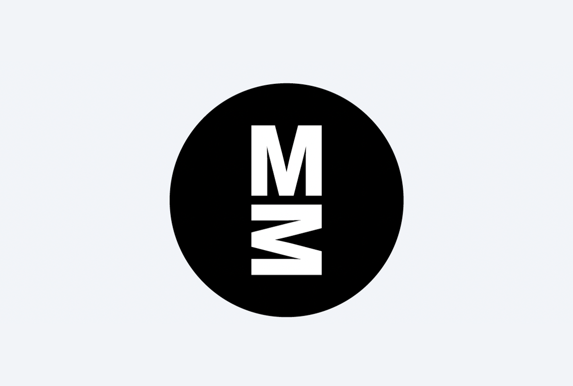 The MIT Museum's social media logo, which has two Ms in white on a black circle.